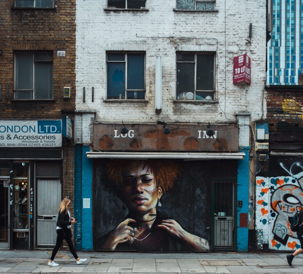 Mural of a black woman on a shopfront