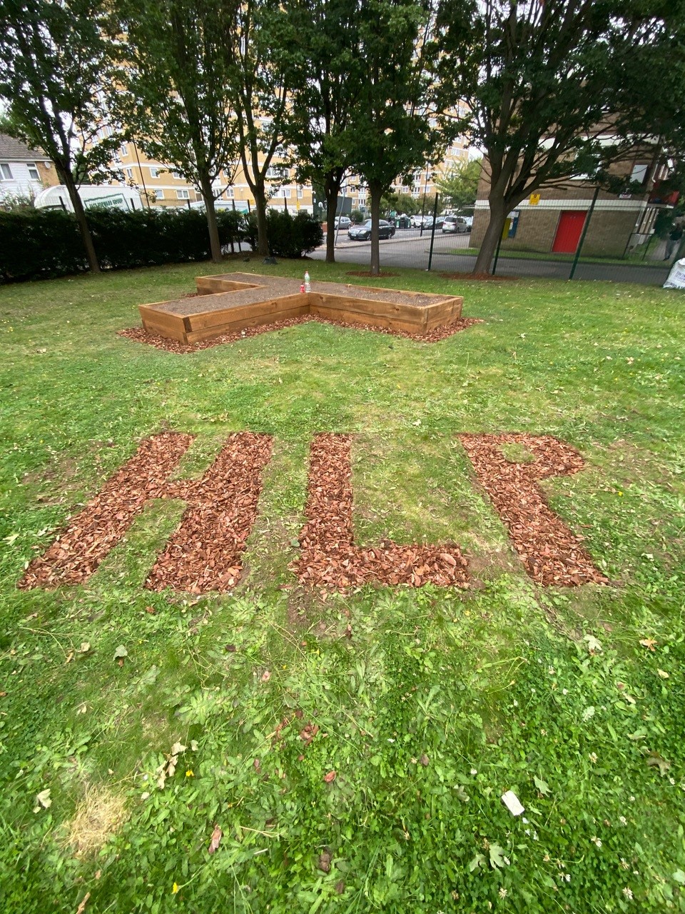 Letters HLP as lawn art for Haringey Learning Partnership